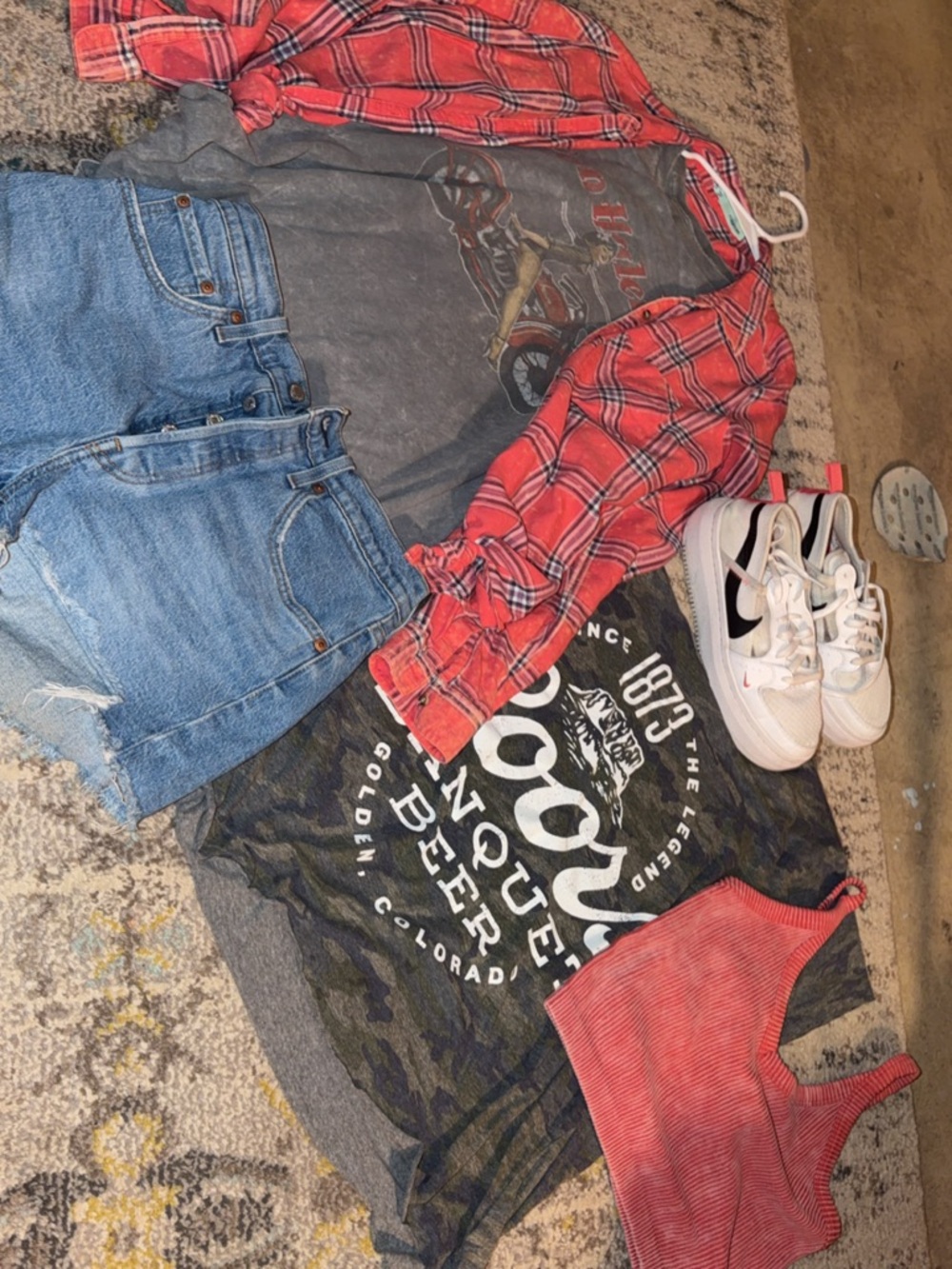 Levi's Red Plaid Shirt with Black Graphic Tee and Light Blue Denim Shorts